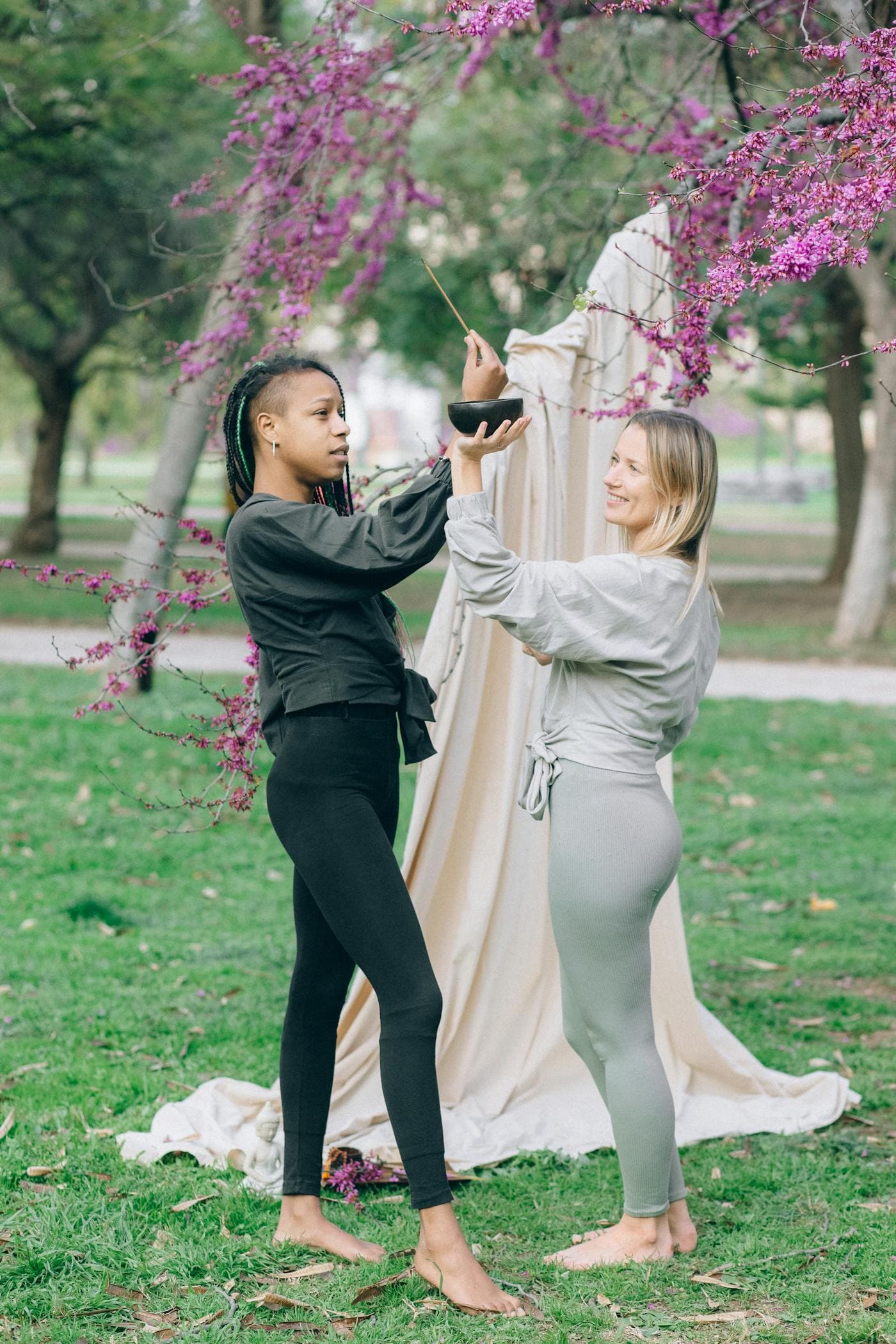 Two women practicing wellness outdoors