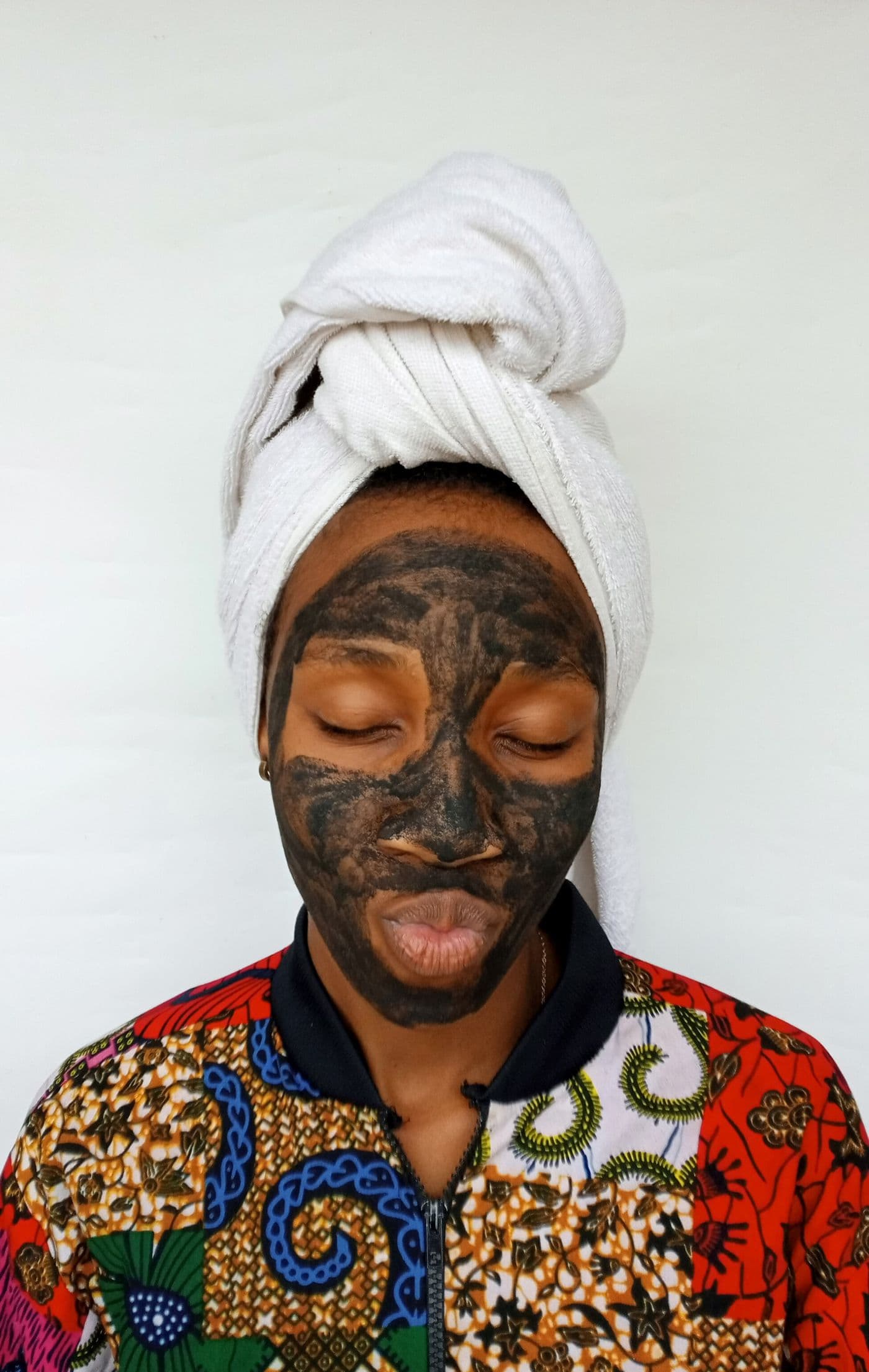 African woman practicing a clean skincare routine